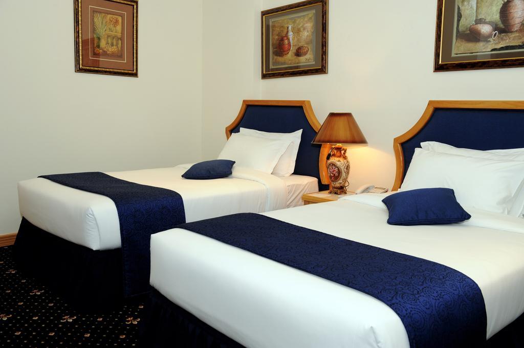 Cayam Hotel Doha Rom bilde